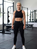 Katya in the YFYF Black Gold Logo leggings, front view