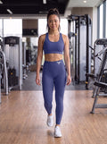 Kira in YFYF Royal Blue high-waisted leggings, White Logo, worn, front