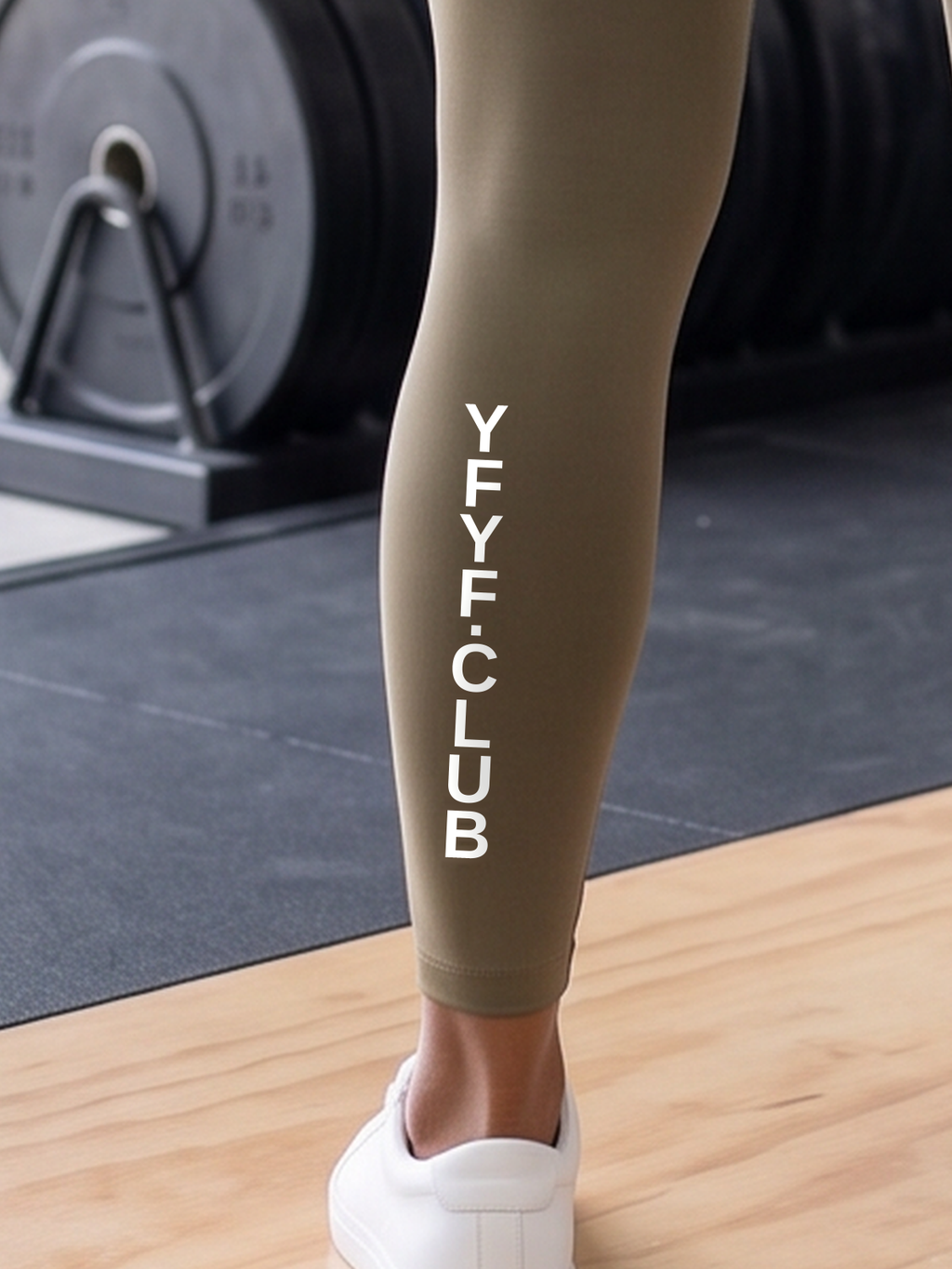 YFYF Olive White Logo leggings, close-up of YFYF.CLUB on the left calf