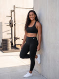 Talea wearing Black Full Brand high-waisted leggings, front view with white FF logo
