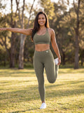 Elkie wearing Olive Full Brand high-waisted leggings, front view with white FF logo