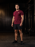 Clarke wearing the YFYF Oxblood Heavyweight Cotton Tee, front, gold FF chest logo, in the gym