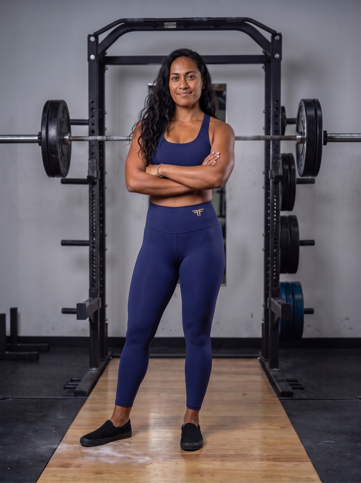 Talea in the weights room in YFYF Royal Blue high-waisted leggings, Gold Logo, worn, front