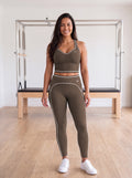 Elkie in YFYF Fortune Racerback Crop Top – Coffee, front, worn with Outline leggings in Coffee (sold separately)