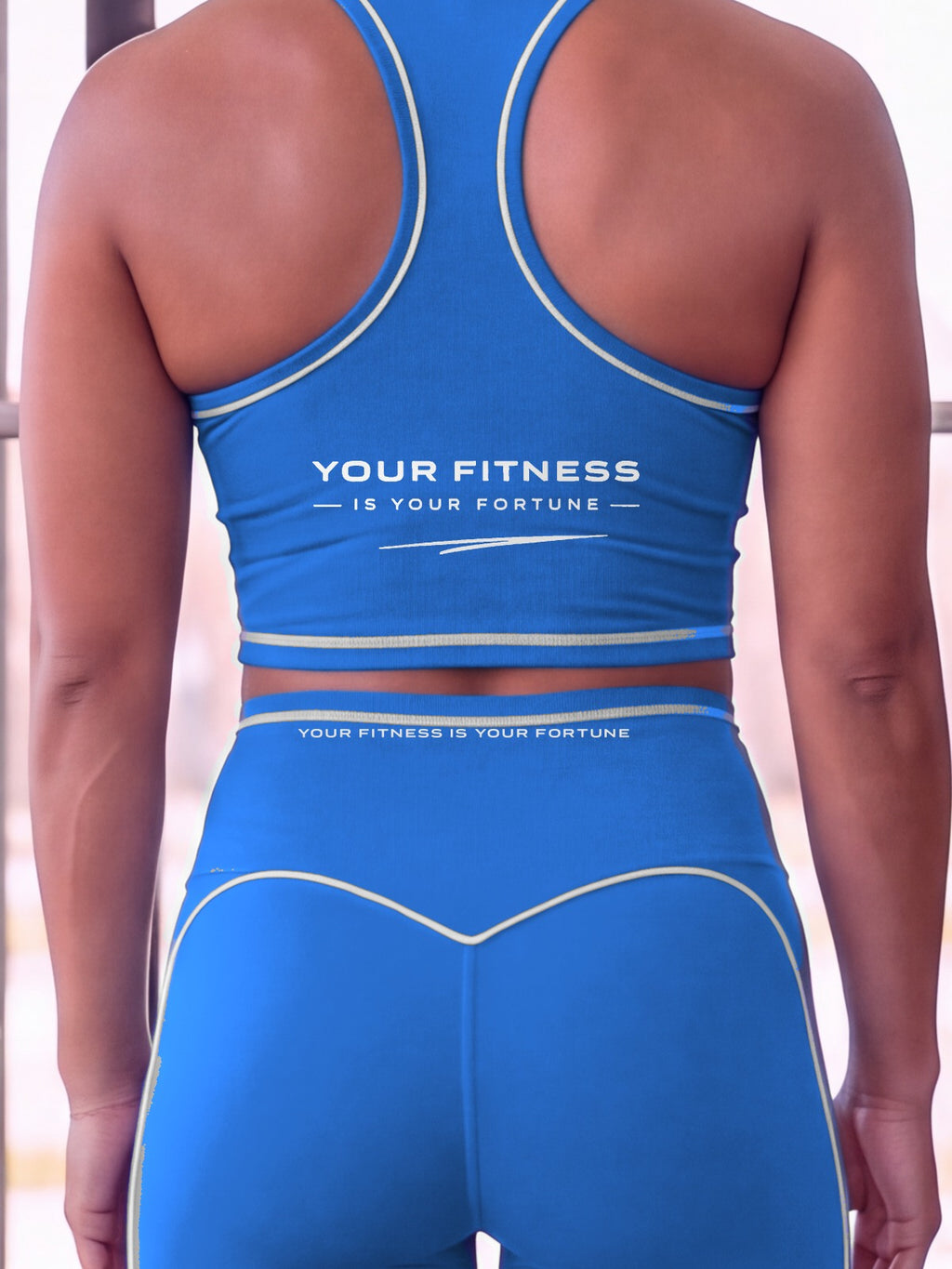 Close-up of the Your Fitness Is Your Fortune, with a signature stroke back print on the YFYF Fortune Signature Racerback Crop Top – Coastal Blue