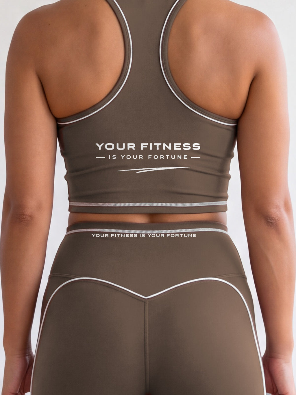 Close-up of the Your Fitness Is Your Fortune, with a signature stroke back print on the YFYF Fortune Signature Racerback Crop Top – Coffee