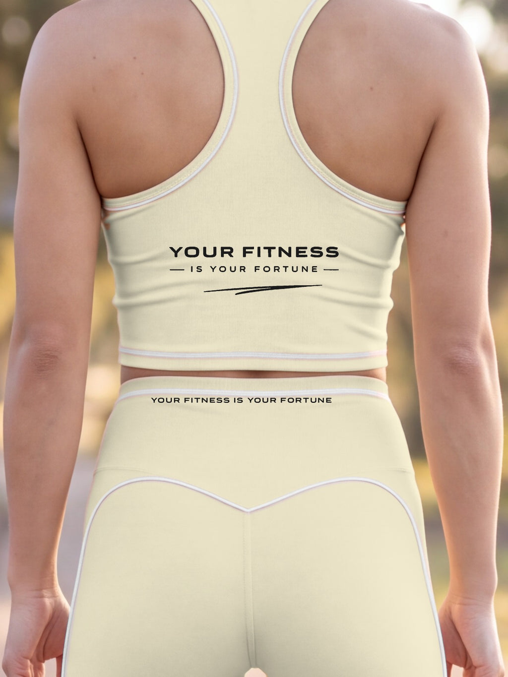 Close-up of the Your Fitness Is Your Fortune, with a signature stroke back print on the YFYF Fortune Signature Racerback Crop Top – Light Apricot