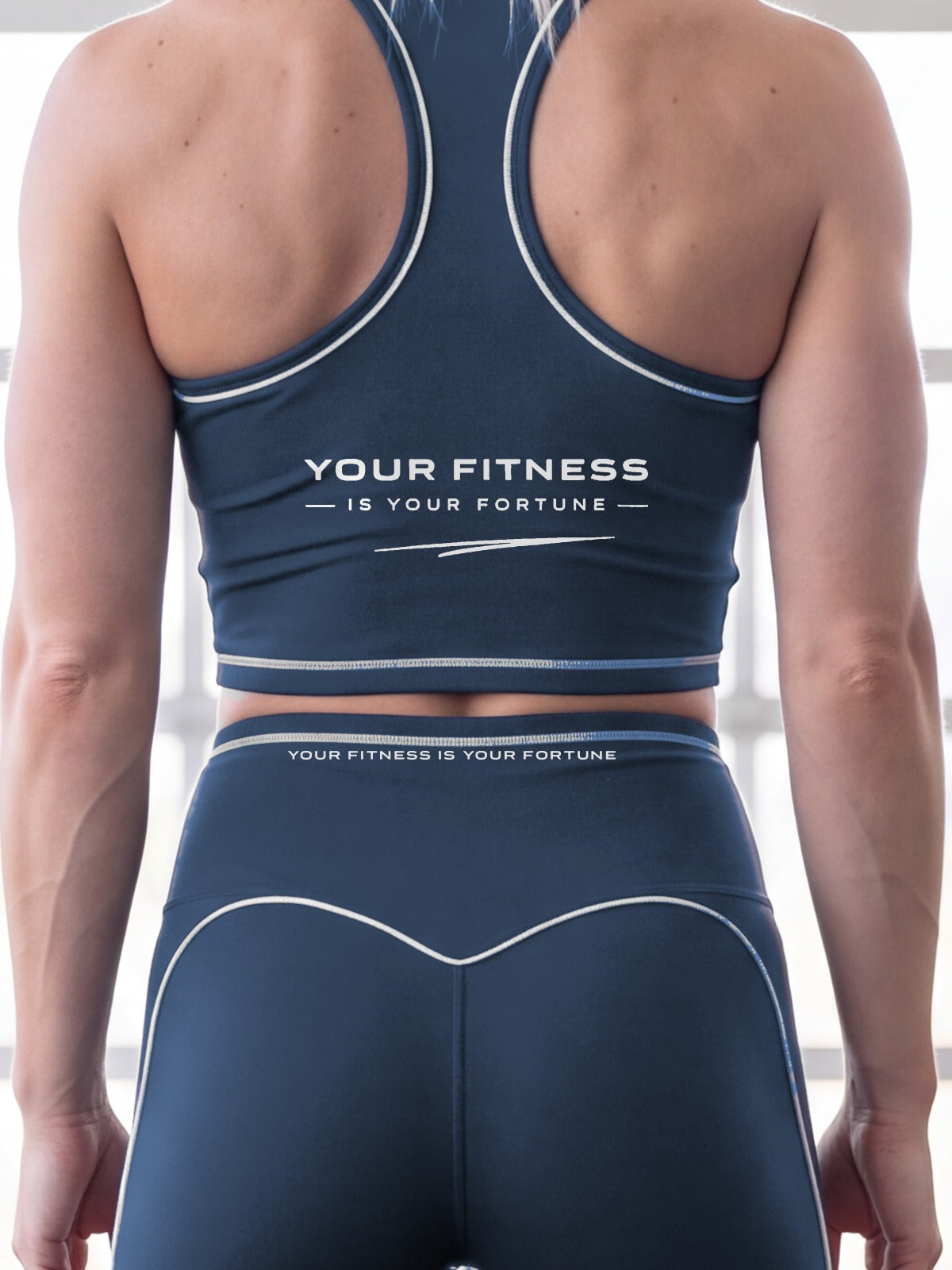 Close-up of the Your Fitness Is Your Fortune, with a signature stroke back print on the YFYF Fortune Signature Racerback Crop Top – Navy Blue