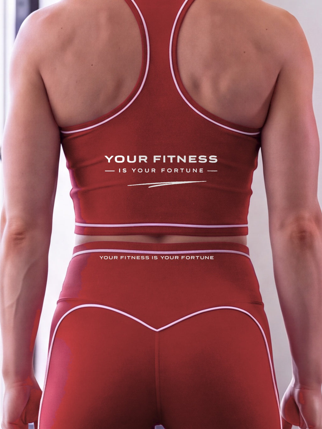 Close-up of the Your Fitness Is Your Fortune, with a signature stroke back print on the YFYF Fortune Signature Racerback Crop Top – Red