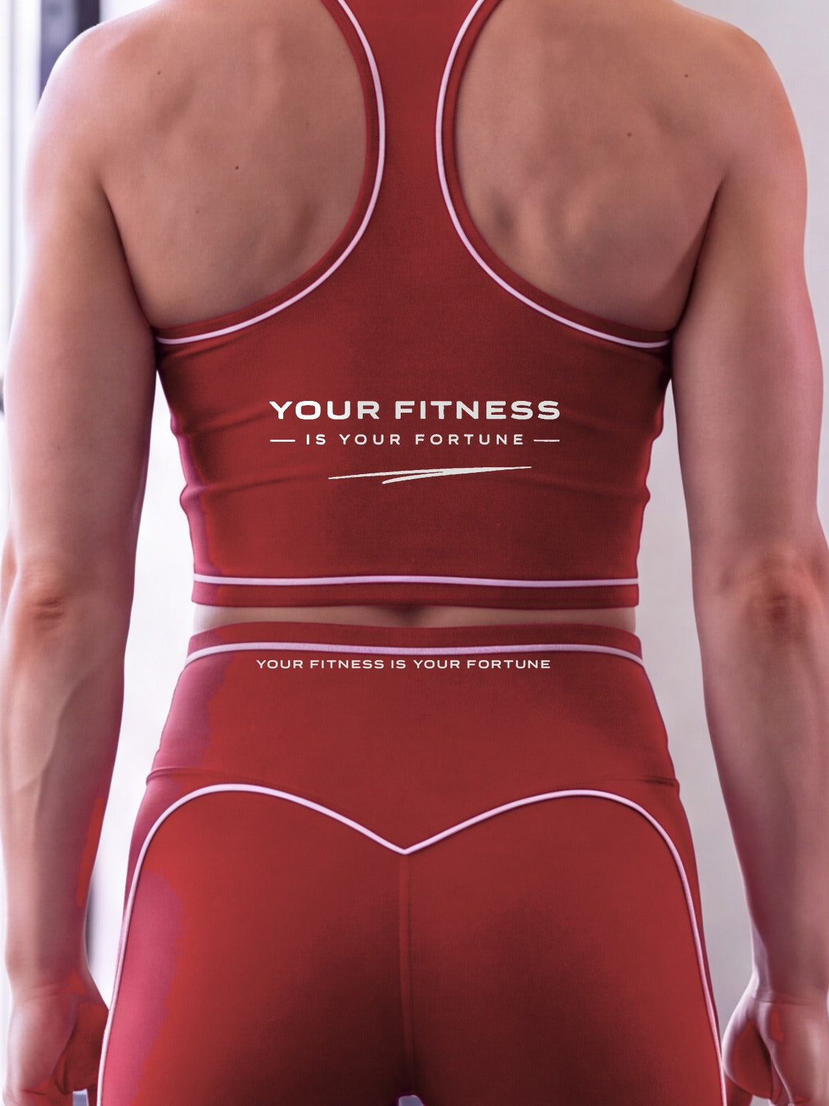 Close-up of the Your Fitness Is Your Fortune, with a signature stroke back print on the YFYF Fortune Signature Racerback Crop Top – Red