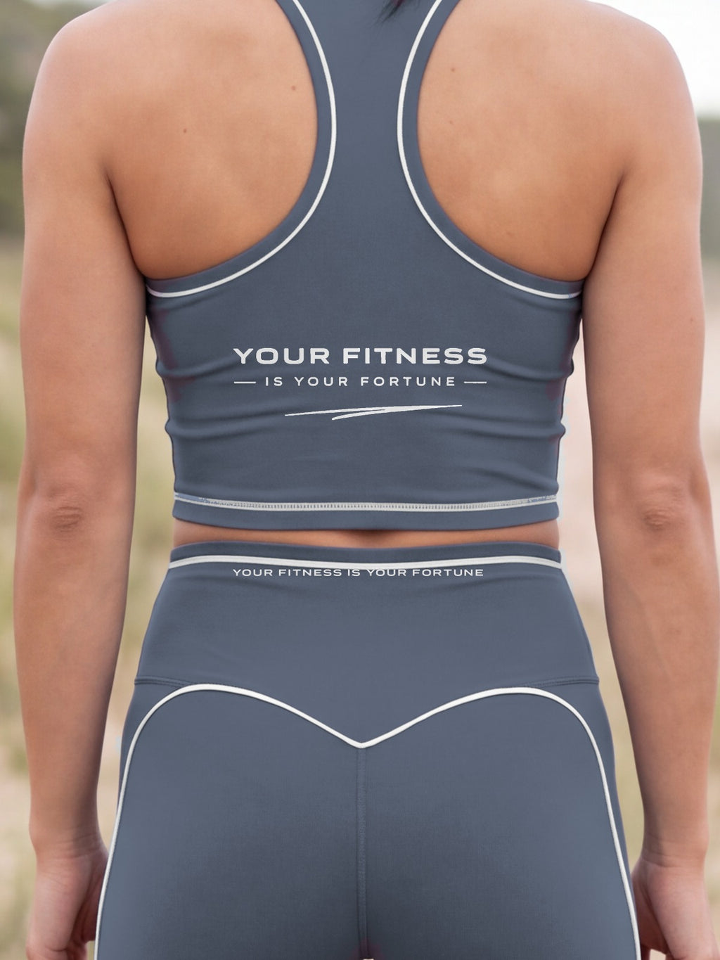 Close-up of the Your Fitness Is Your Fortune, with a signature stroke back print on the YFYF Fortune Signature Racerback Crop Top – Storm Blue